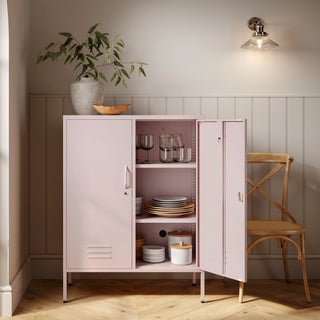 The Fulham metal storage locker in light pink with 2 doors, one open showing tableware inside