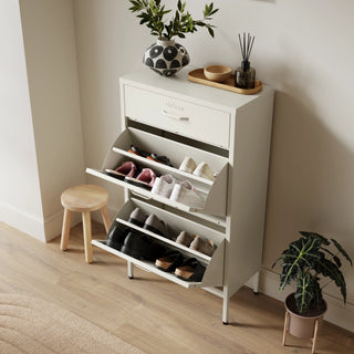 The Shoreditch shoe cabinet in Vanilla with a top drawer, two lower shoe compartments and matching handles, styled in a hallway.